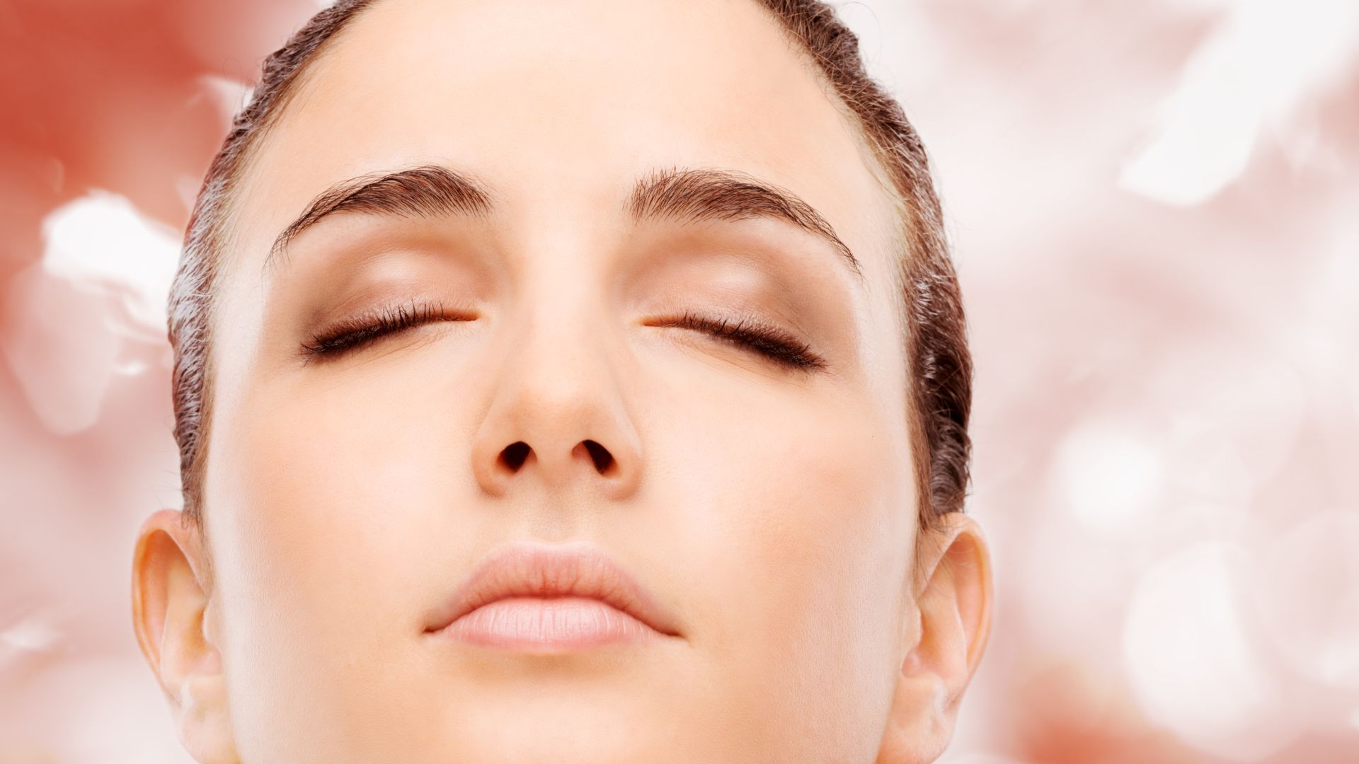 Photo of a glowing and radiant face after a treatment at Agigma Holistic Spa